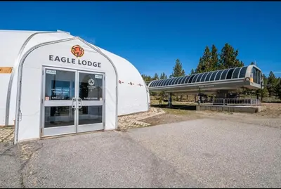a large white building with a door in front at Juniper Springs Lodge 437 in Mammoth Lakes