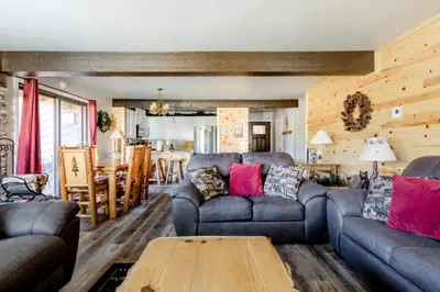a living room with a couch and a table at Mammoth Creek 29 in Mammoth Lakes