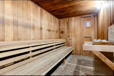 a sauna with a wooden bench in a room at Mammoth Creek 29 in Mammoth Lakes