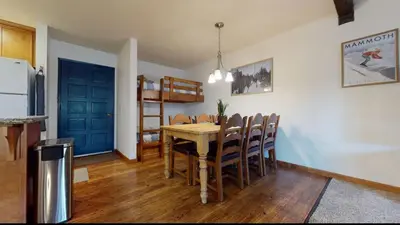 a kitchen and dining room with a table and chairs at Chamonix 17 in Mammoth Lakes