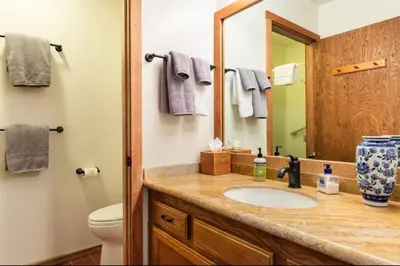 a bathroom with a sink and a mirror at Snowcreek 290 in Mammoth Lakes