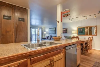 a kitchen with a sink and a counter top at Summit 33 in Mammoth Lakes