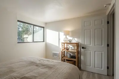 a bedroom with a bed and a window at San Sierra 19 in Mammoth Lakes