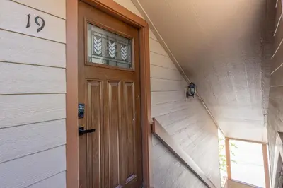 a wooden door on the side of a house at San Sierra 19 in Mammoth Lakes