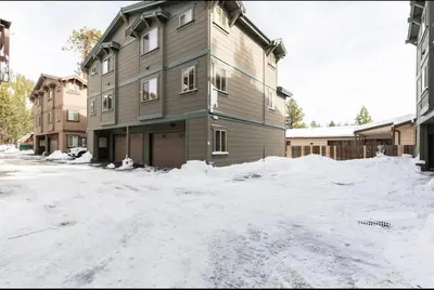 a building with a lot of snow in front of it at Gray Eagle 5 in Mammoth Lakes