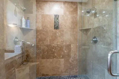 a bathroom with a shower with a glass door at Stonegate 11 in Mammoth Lakes