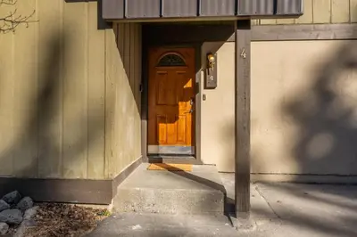 a wooden door on the side of a building at Chateau De Montagne 4 in Mammoth Lakes