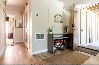 a hallway with a console table in a house at Seasons Four 165 in Mammoth Lakes