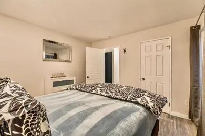 a bedroom with a bed and a mirror on the wall at Bigwood 5 in Mammoth Lakes