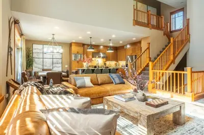 a living room with a couch and a table at Timbers 1031 in Mammoth Lakes