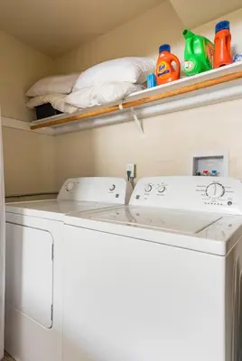 a washer and dryer sitting in a laundry room at Mammoth View Villas 20 in Mammoth Lakes