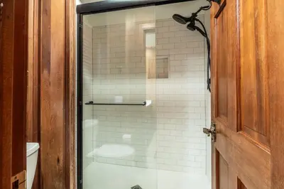 a bathroom with a shower with a glass door at Canyon Ski and Racquet 3 in Mammoth Lakes