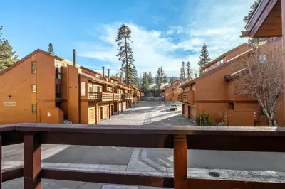 a row of buildings on a street at Canyon Ski and Racquet 3 in Mammoth Lakes