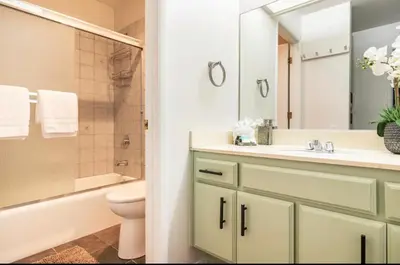 a bathroom with a sink and a toilet and a mirror at Seasons Four 193 in Mammoth Lakes