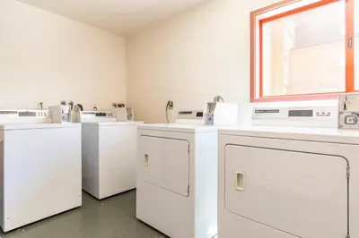 a laundry room with white washers and dryers at Aspen Creek 219 in Mammoth Lakes