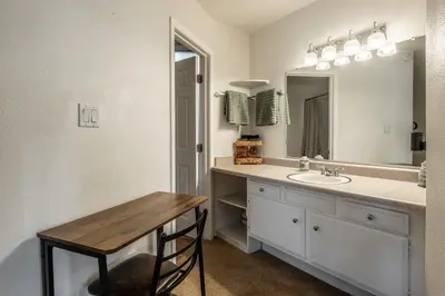 a bathroom with a sink and a mirror at Sierra Park Villas 17 in Mammoth Lakes