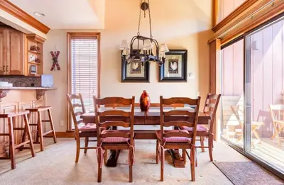 a dining room with a table and chairs at Mammoth Ski and Racquet 89 in Mammoth Lakes