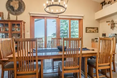 a dining room with a wooden table and chairs at Snowcreek 821 in Mammoth Lakes