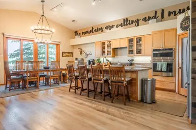 a kitchen and dining room with a table and chairs at Snowcreek 821 in Mammoth Lakes