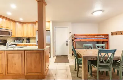 a kitchen and dining room with a table and chairs at Summit 43 in Mammoth Lakes