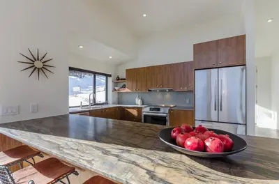 a kitchen with a bowl of fruit on a counter at 88 Bridges Lane in Mammoth Lakes