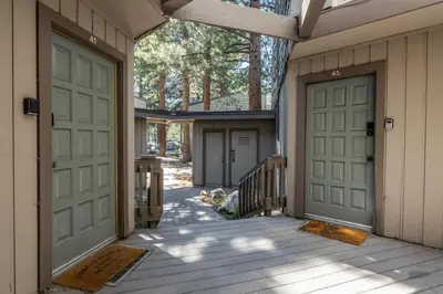a couple of doors on a house with a porch at Sierra Park Villas 45 in Mammoth Lakes