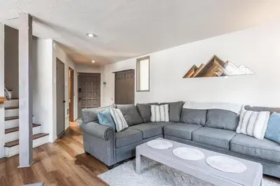 a living room with a couch and a table at Sierra Park Villas 45 in Mammoth Lakes