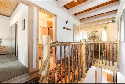 a hallway with a wooden staircase in a house at Val DIsere 14 in Mammoth Lakes
