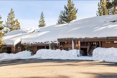 a snow covered building with a pile of snow at Val DIsere 14 in Mammoth Lakes