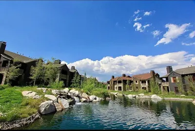 a river in a town with houses and condos at Lodges 1129 in Mammoth Lakes