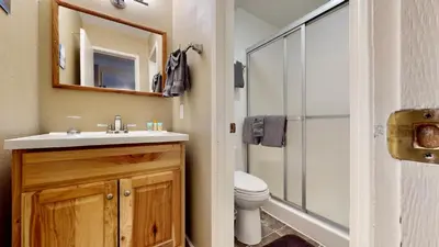 a bathroom with a toilet and a sink and a shower at Crestview 45 in Mammoth Lakes