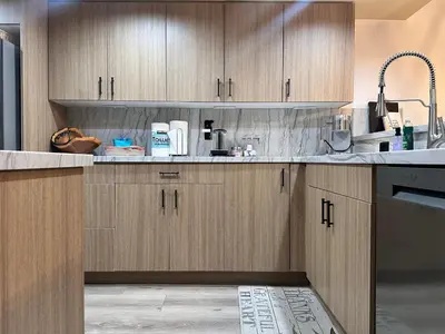 a kitchen with wooden cabinets and a sink at Bridges 210 in Mammoth Lakes