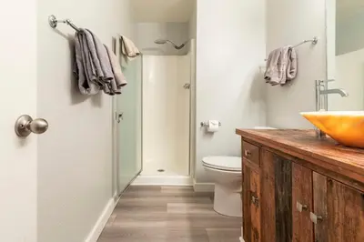 a bathroom with a sink and a toilet and a shower at Chamonix 91 in Mammoth Lakes