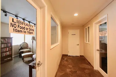 a hallway with a no food or drink sign on the wall at Chamonix 91 in Mammoth Lakes