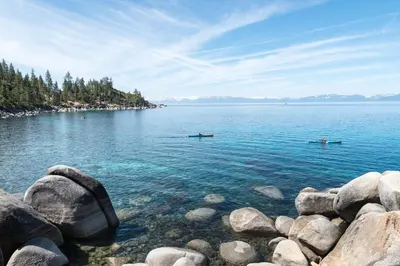 two people in boats on a large body of water at Everline Resort & Spa 534 & 536 in Olympic Valley