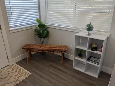 a room with a table and a plant and a window at 717 Charming 4 Bed Mid-Town Retreat in Reno