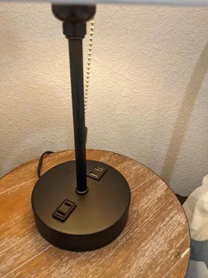 a black lamp sitting on top of a wooden table at 717 Charming 4 Bed Mid-Town Retreat in Reno