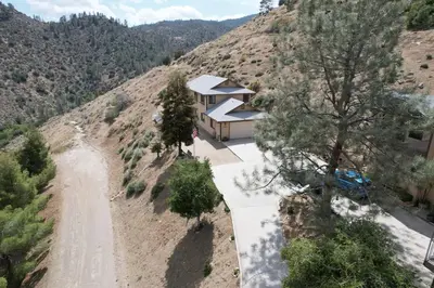 an aerial view of a house on a mountain at Camp David in Wofford Heights