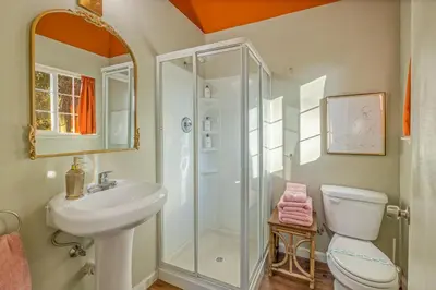 a bathroom with a shower and a toilet and a sink at 16 mi to Yosemite - Rustic Studio - Hiking Nearby in Oakhurst