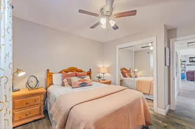 a bedroom with two beds and a ceiling fan at Lake View Private Dock 18 miles to Yosemite in Bass Lake
