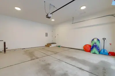 an empty room with white walls and a room with colorful objects at Tahoe Toasty - 3 Bedroom Home Near Sledding Hill in South Lake Tahoe