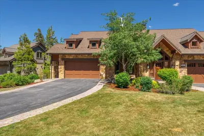 a house with a driveway and a garage at 2 Luxury Adjacent Northstar Homes Walk to Lifts Private Hot Tubs in Truckee