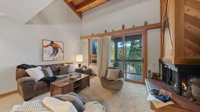 a living room with a couch and a fireplace at Unique Northstar Cabin w Fireplace Minutes to Skiing Trails and Town Alpine Bend by AvantStay in Truckee