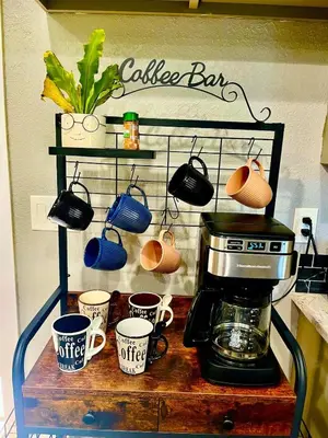 a coffee maker and coffee cups on a counter at Private Home,Ski HotTub,Firepit,Apple Hill,Tahoe in Placerville