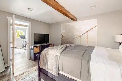 a bedroom with a large bed and a tv at Private Home,Ski HotTub,Firepit,Apple Hill,Tahoe in Placerville