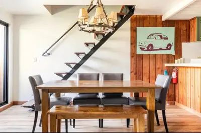 a dining room with a wooden table and chairs at Val DIsere 27 in Mammoth Lakes