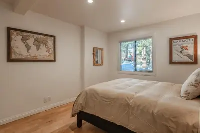 a bedroom with a bed and a window at Summit 107 in Mammoth Lakes