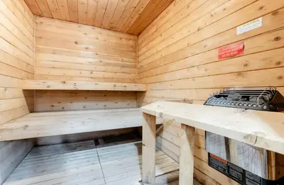 a wooden sauna with a bench in it at Summit 107 in Mammoth Lakes