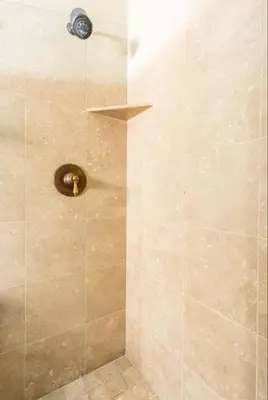 a shower with a glass door and a metal showerigun at Stonegate 12 in Mammoth Lakes