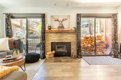 a living room with a fireplace and a couch at Hidden Valley 33 in Mammoth Lakes